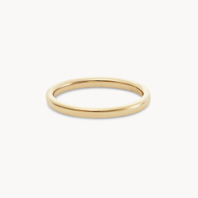 The Endalaus II ring by beloved by bluboho, made from 14k yellow gold and featuring a white diamond, is displayed against a plain white background. Its smooth and polished surface enhances its sleek and elegant appearance.