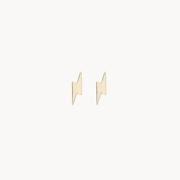 A pair of "Everyday little lightning bolt earring - 14k yellow gold" from bluboho, featuring a minimalist design with sharp angles and a polished finish, pictured on a plain white background.