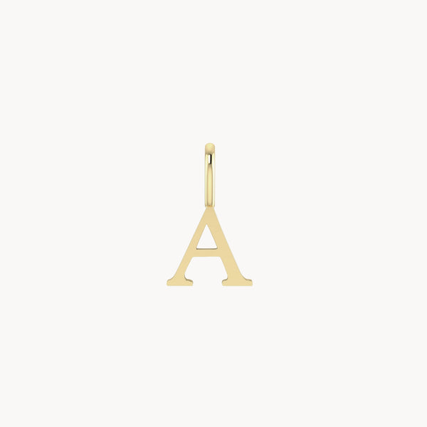 A letter charm - 10k yellow gold by bluboho shaped like the capital letter "A" with a smooth, polished finish. The pendant has a small loop at the top for threading through a necklace or chain. It is set against a plain white background.