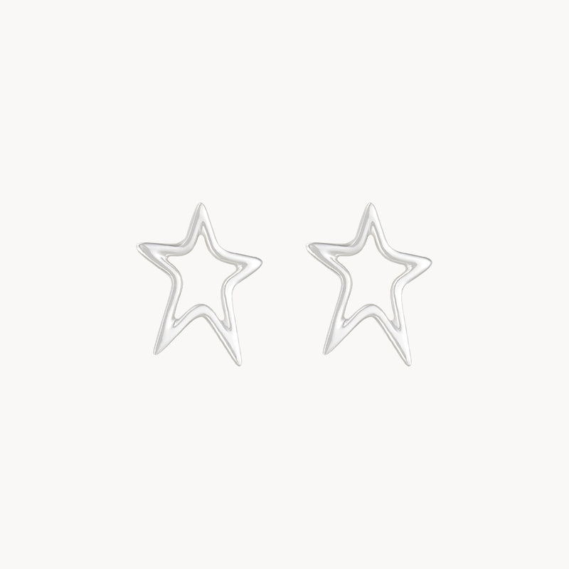 Introducing the Bright Star Earrings by Bluboho: sterling silver, intricately designed with an outline of a five-pointed star against a pristine white background.