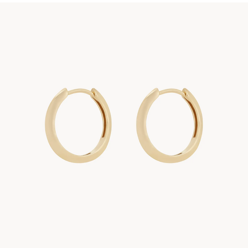 A pair of dagger medium hoop - 14k yellow gold hoop earrings by bluboho with a simple, smooth design, placed against a plain white background.