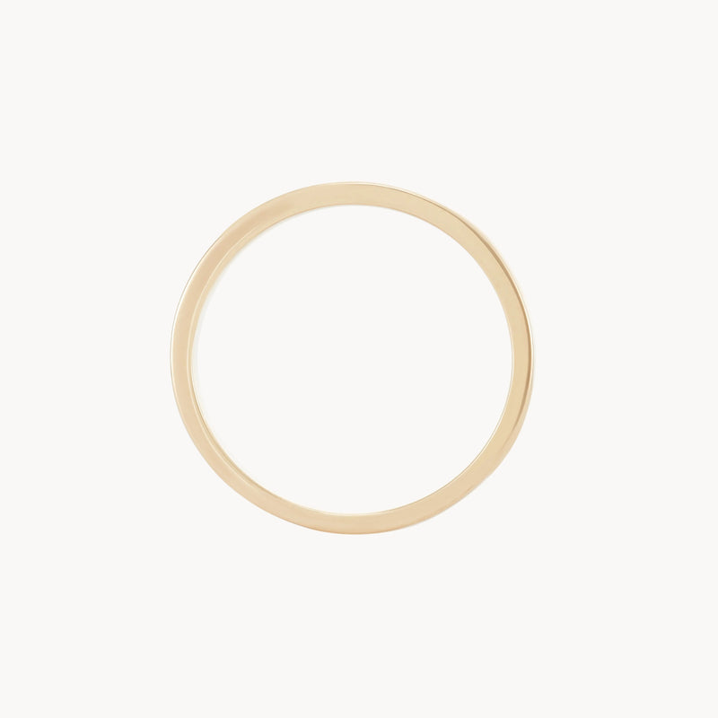 A simple, elegant infinity love band polished in 14k yellow gold by beloved by bluboho against a plain white background, showcasing a minimalistic and classic design.