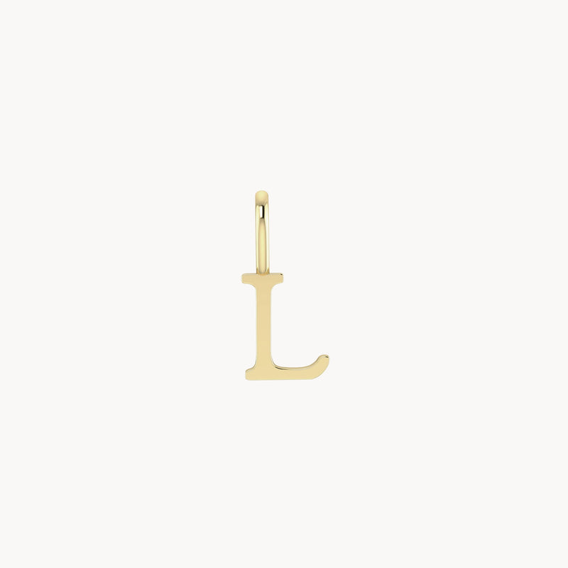 A bluboho letter charm - 10k yellow gold featuring the uppercase letter "L" with a small loop at the top for attaching to a necklace or bracelet. The letter has a smooth, polished surface and a modern design. The background is plain white.