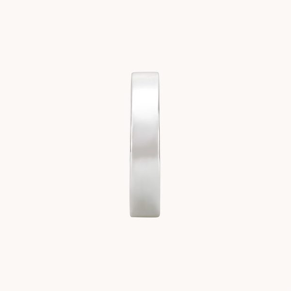 The legacy ring silver from bluboho, crafted from sterling silver, is displayed from a top view lying flat against a white background. Its minimalist design boasts a smooth, polished finish and a perfectly rounded shape, creating an elegant and simple aesthetic.