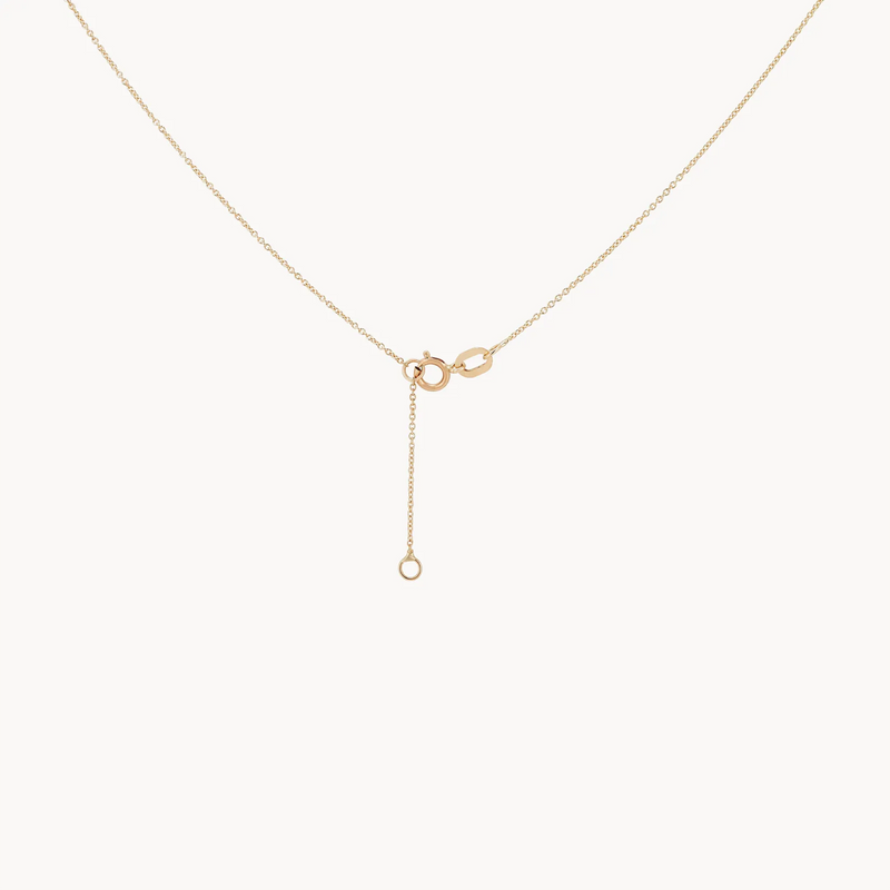 The large supernova necklace by bluboho features a delicate gold chain with a simple, elegant clasp. A small extension chain dangles from the clasp, finishing with a single loop at the end. The necklace is elegantly displayed on a white background.