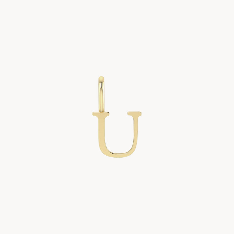 A letter charm - 10k yellow gold from bluboho in the shape of the letter "U" with a simple hoop design at the top. The earring is isolated on a white background.