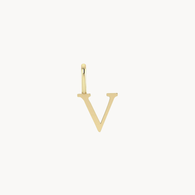 A gold pendant in the shape of the letter "V" on a small loop. The design is simple and elegant with clean lines, appropriate for a necklace or bracelet charm. The background is white, highlighting the bluboho letter charm - 10k yellow gold's metallic sheen.