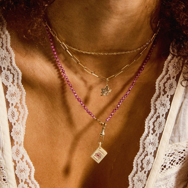 glowing hearts reversible passport charm - 10k yellow gold, ruby gemstone