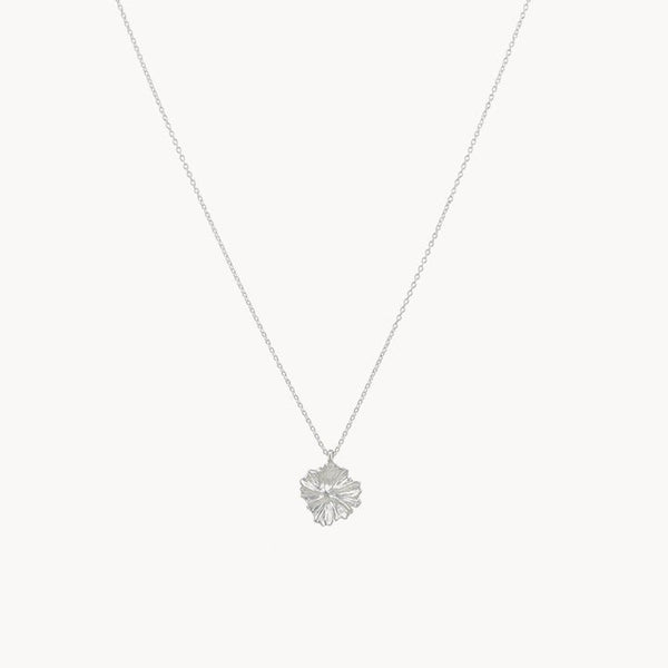 Presenting the larger wildflower necklace from bluboho in sterling silver, showcasing a thin chain coupled with an exquisitely detailed maple leaf pendant. The pendant boasts intricate veining and texture, infusing the minimalist design with natural elegance. This delicate piece is beautifully displayed on a plain white background.