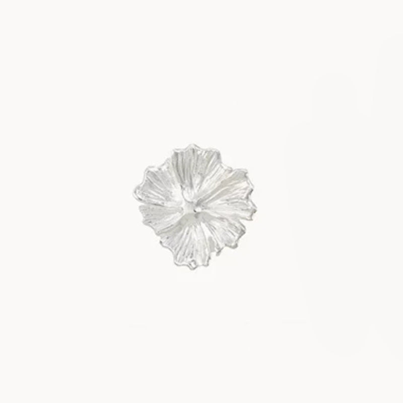 A pair of larger wildflower earrings made of sterling silver from the brand bluboho is centered on a plain white background. The silver petals are intricately detailed and textured, giving them a realistic, symmetrical flower-shaped appearance.