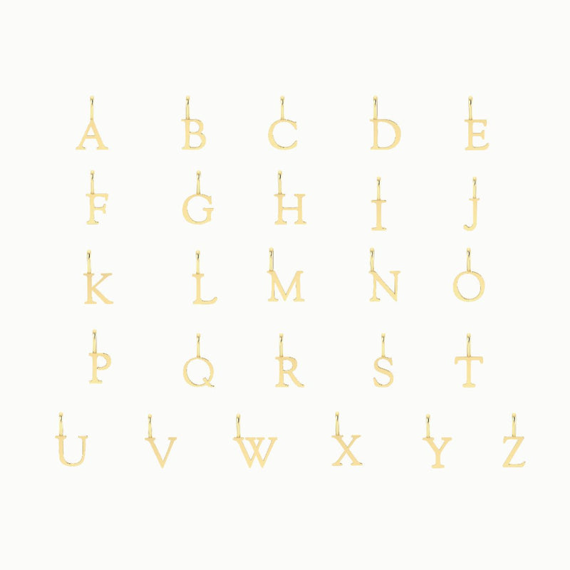 bluboho letter charm - 10k yellow gold displayed in five rows, with each row containing five letters from A to Z against a white background. The letters are capitalized and have small loops at the top for attaching to chains or bracelets.