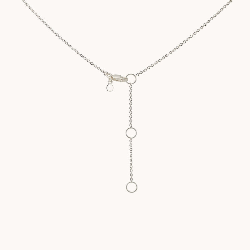 A delicate sterling silver lariat necklace from bluboho, featuring a thin chain. The centerpiece highlights three evenly spaced circular rings along a vertical chain that dangles elegantly from the main loop. The "lovely necklace silver" is showcased on a plain white background.