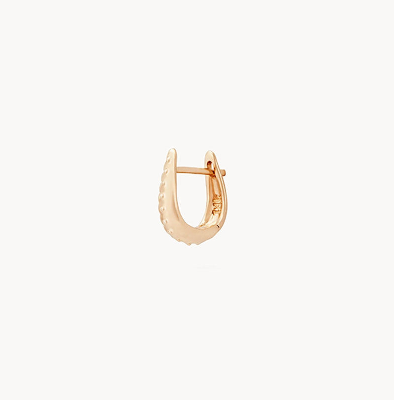 A single "restoration mini hoop - 14k yellow gold" earring by bluboho against a plain white background. The earring is styled with a row of small, evenly spaced dots along its outer edge, adding texture to its sleek design.