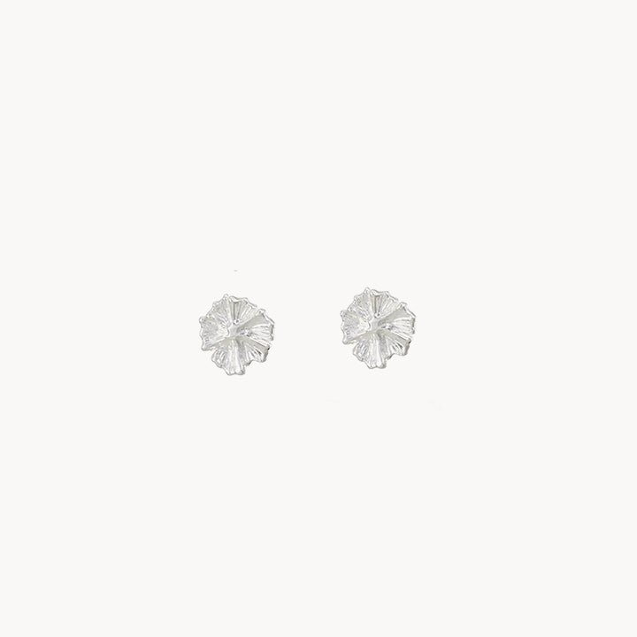 A pair of delicate, flower-shaped stud earrings called the little wildflower earrings from bluboho, crafted from sterling silver and featuring intricate petal details set against a plain white background.