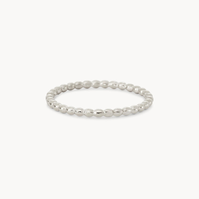 The Abacus ring by bluboho, crafted from sterling silver, is displayed against a white background. The band features closely placed small, round beads, creating a textured yet simple and elegant look.