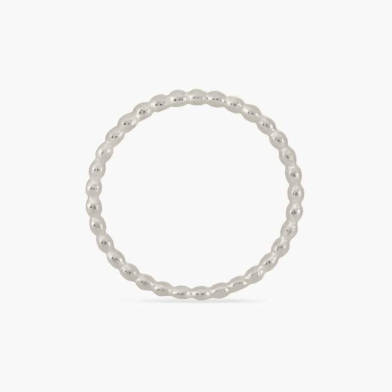 The Abacus ring in sterling silver by bluboho features a delicate and thin band, composed of small, evenly spaced metallic beads forming a continuous loop. Its sleek and minimalistic design is beautifully highlighted against a plain white background.