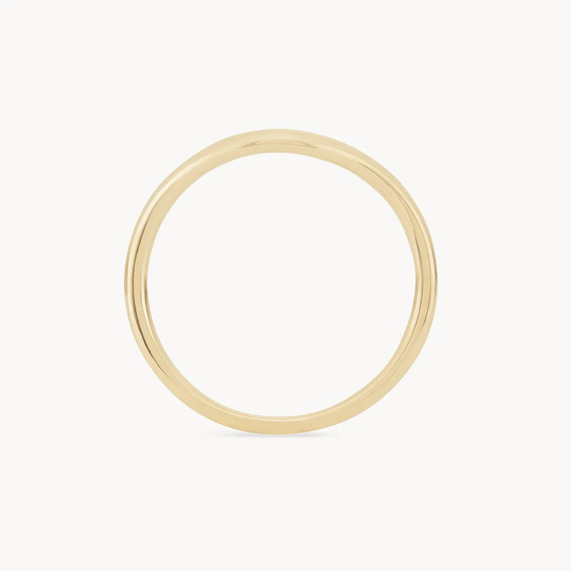 A sleek, thin "plain wave band - 14k yellow gold" ring by Beloved by Bluboho is showcased against a plain white background, featuring a smooth, polished finish with no additional designs or embellishments.