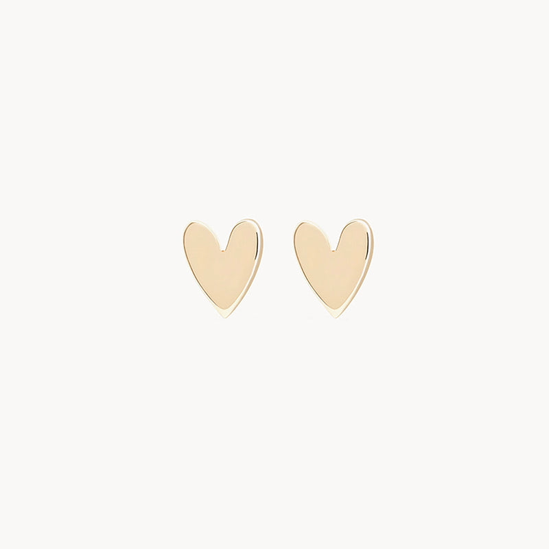 Pair of bluboho's Everyday Larger Lovely Heart Earrings in 14k yellow gold against a white background.