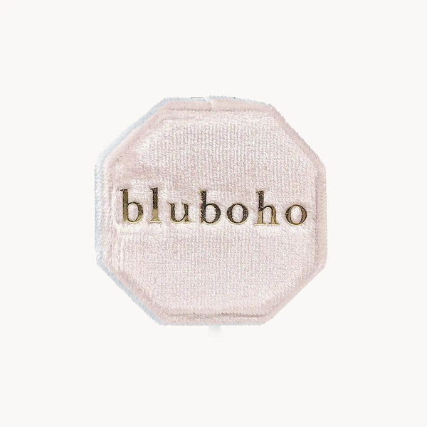 A blush-colored velvet octagonal box, branded with "beloved by bluboho" in gold font on the lid, set against a plain white background.