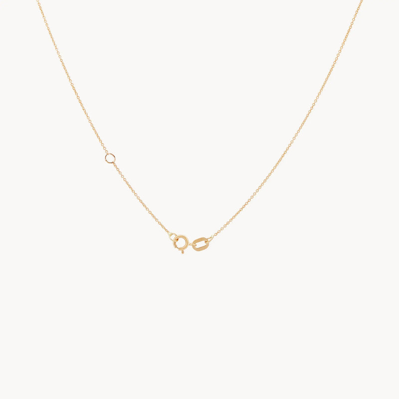 A delicate gold chain necklace featuring a lobster claw clasp and a visionary evil eye pendant in 14k yellow gold by bluboho, shown on a plain white background.